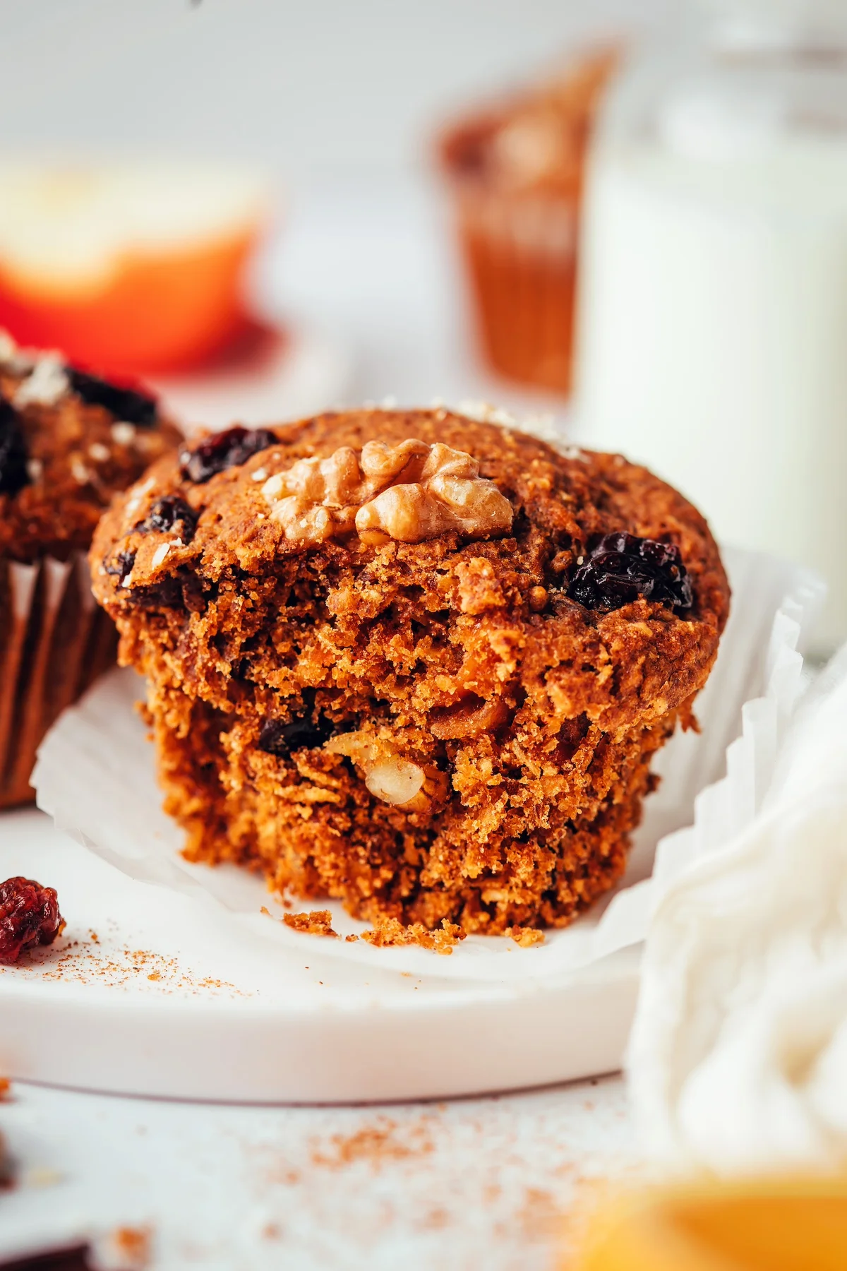 Baked morning glory muffins topped with walnuts and dried fruit