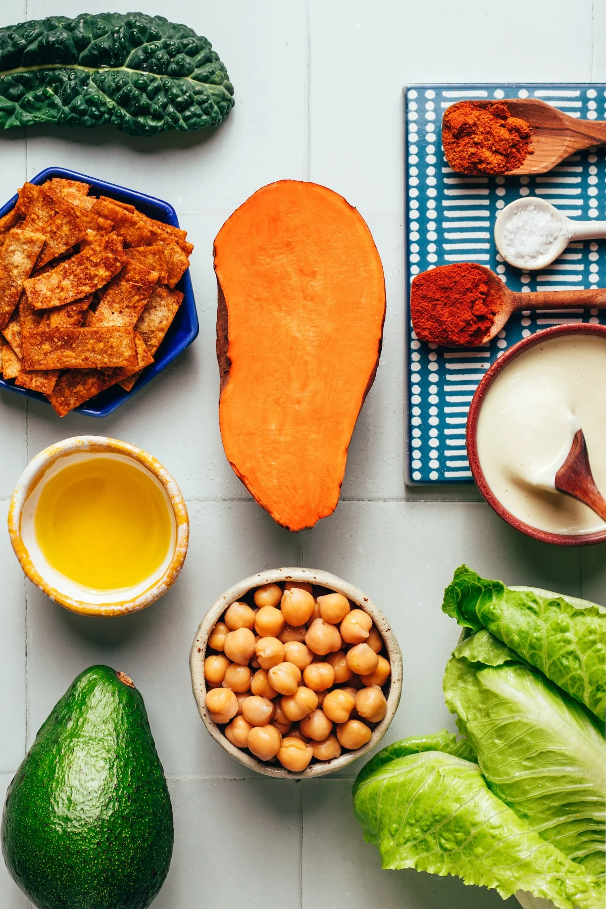 Roasted sweet potatoes and spiced chickpeas on a baking sheet