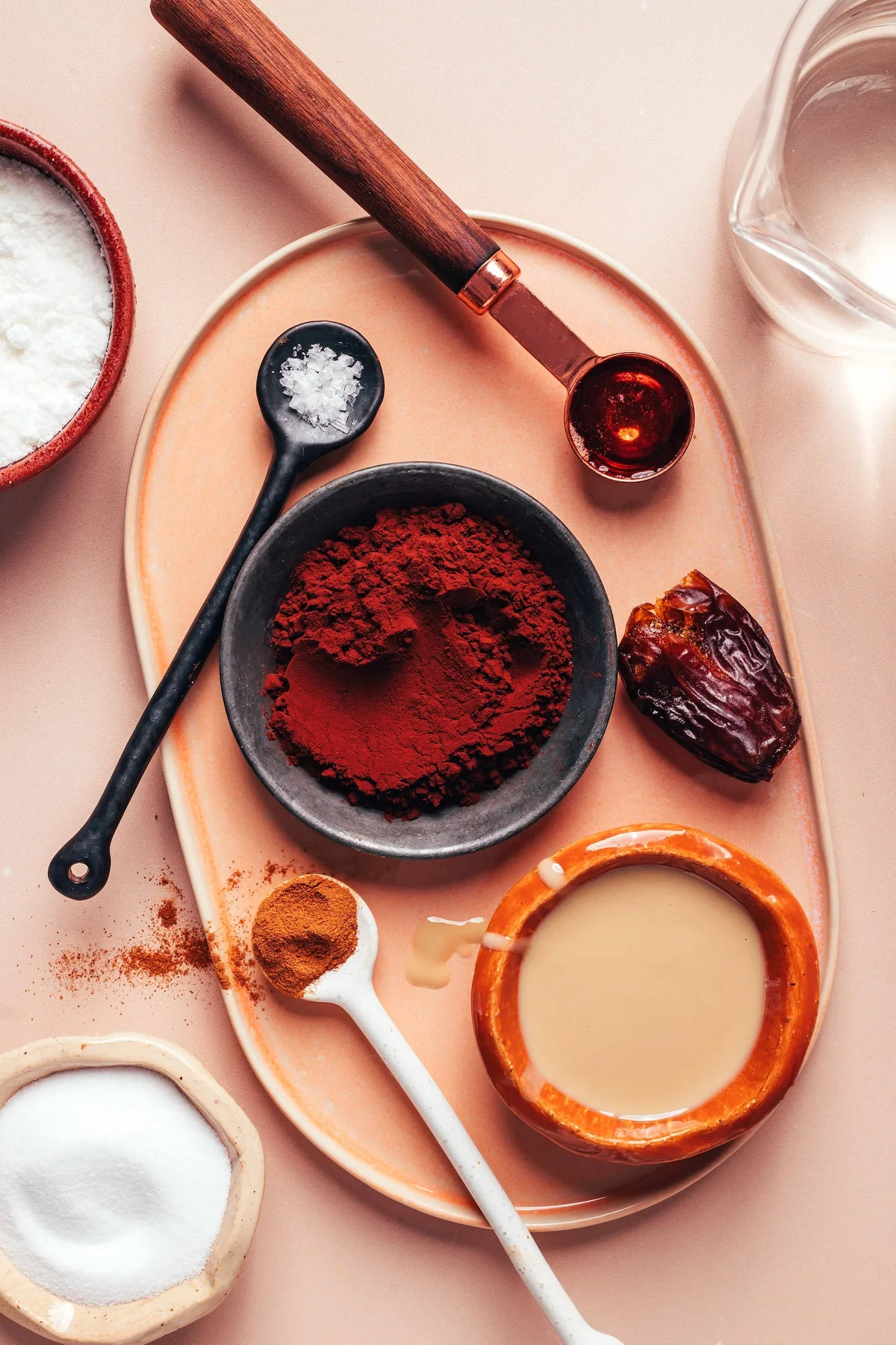 Tahini hot chocolate ingredients: cocoa, date, spices, syrup