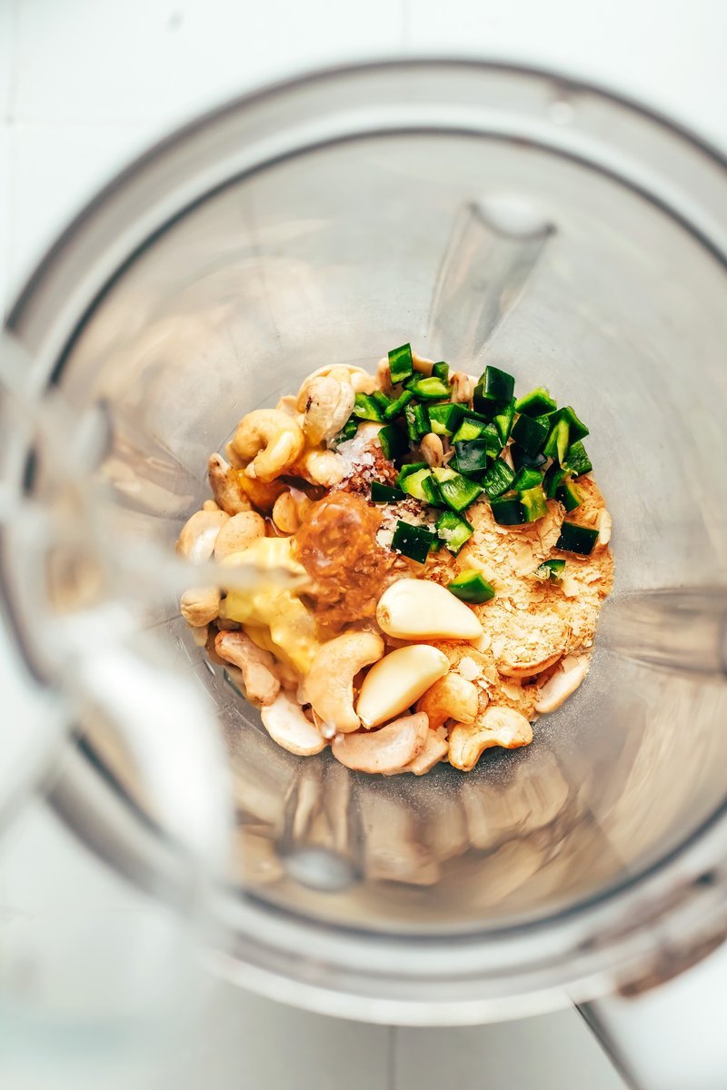 Cashews, garlic, and chopped jalapeño in a blender before blending
