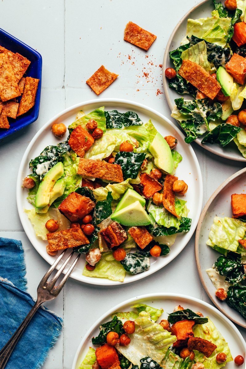 Creamy cashew dressing poured over the finished vegan taco salad