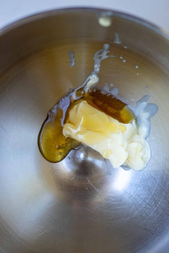 Butter and honey beat together in a mixing bowl