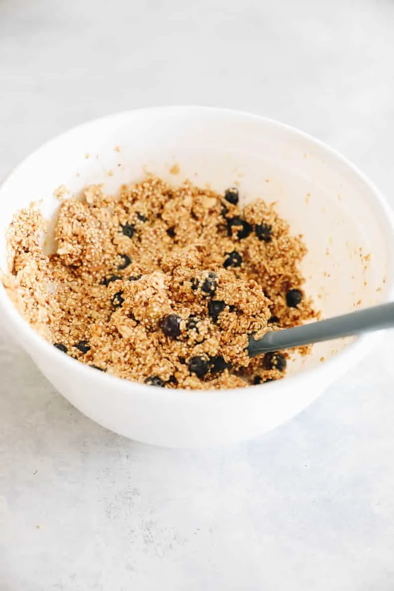 Baked blueberry quinoa bars cut into squares in a baking pan