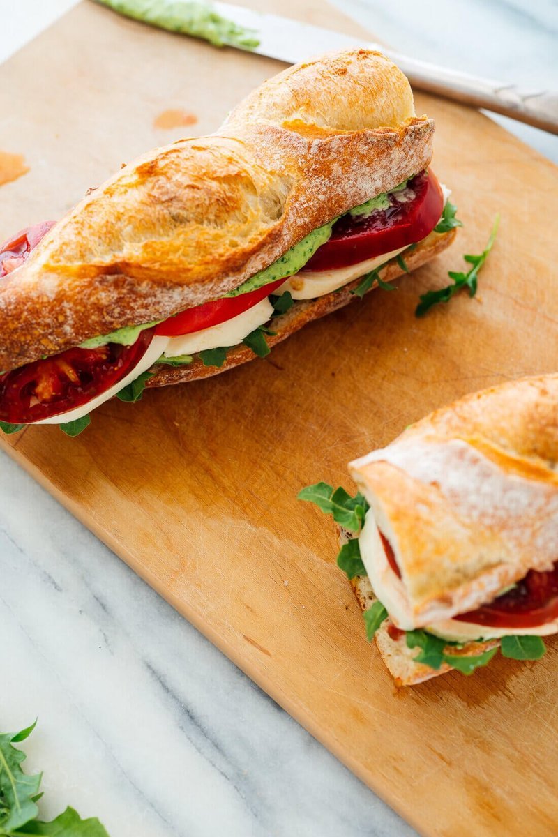 Caprese sandwich with tomato mozzarella and basil on a plate
