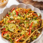 Bowl of crispy rice salad with roasted tofu and vegetables