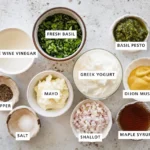 Flat-lay of salad dressing ingredients in small labeled bowls