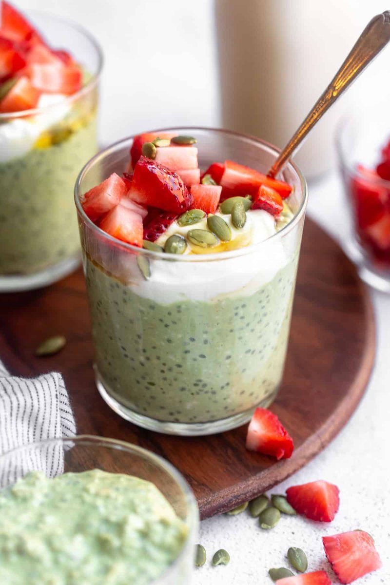 Finished matcha overnight oats layered with strawberries and pumpkin seeds