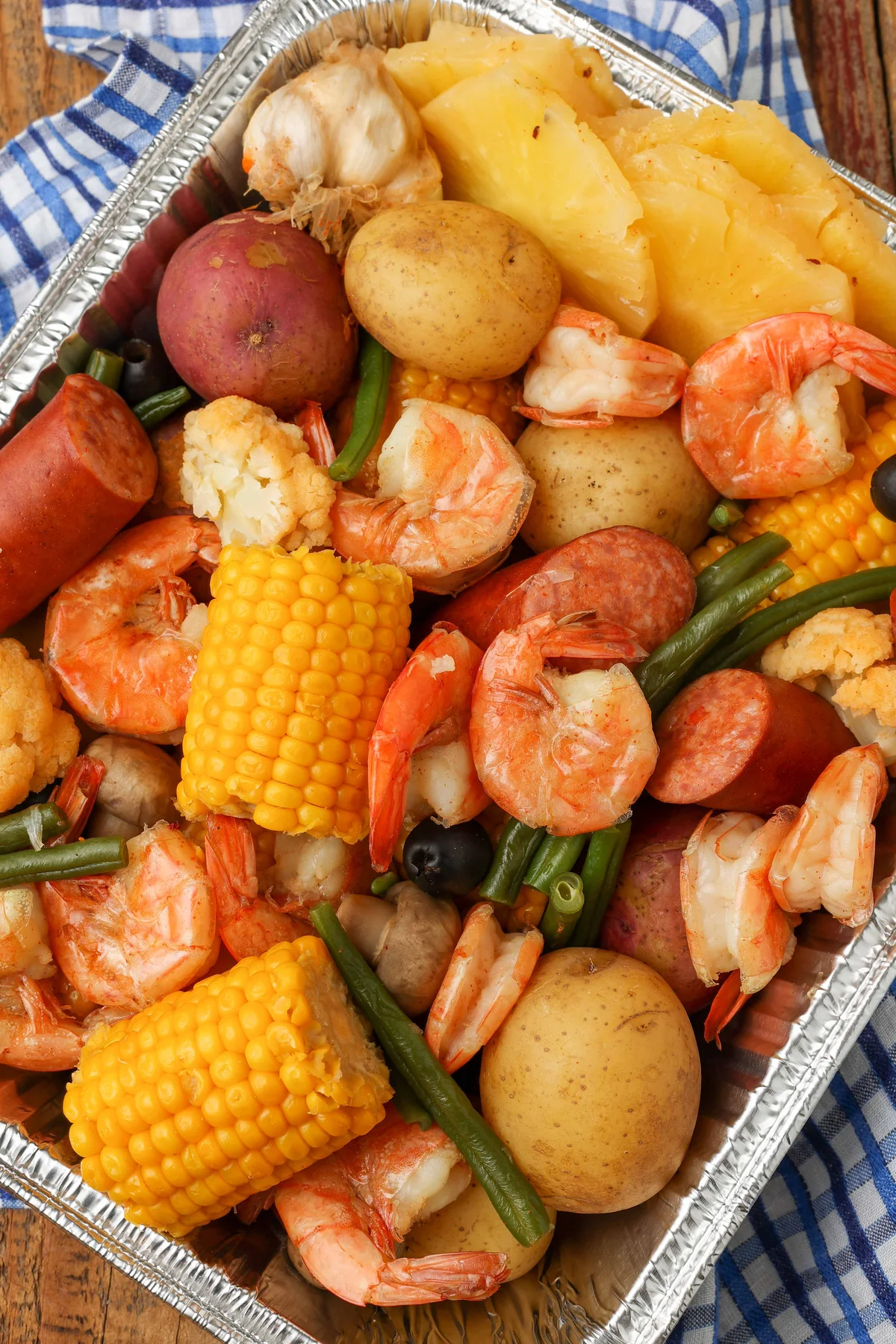 Overhead of the finished boil tray with corn, sausage and shrimp