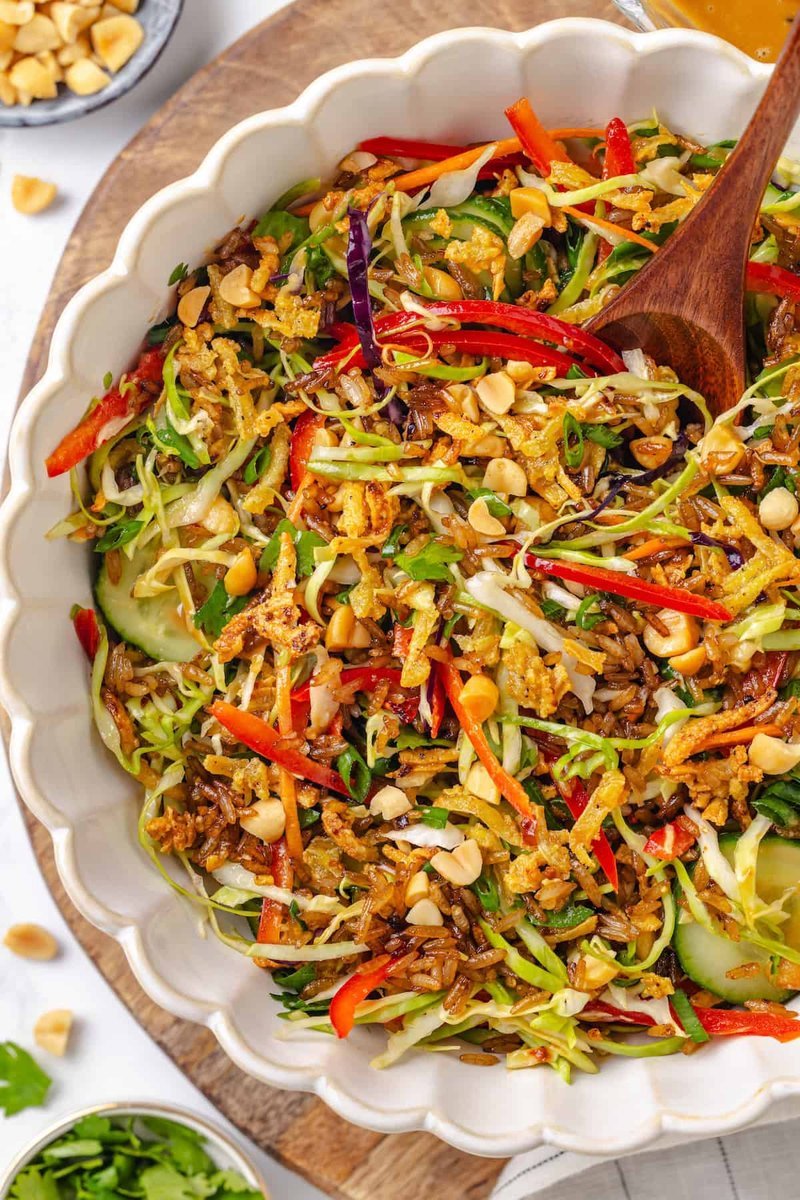 Finished crispy rice salad with peanut sauce in bowl