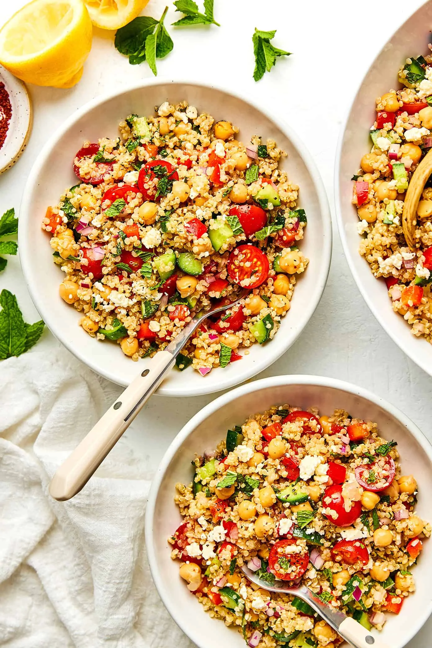Colorful quinoa salad with feta and herbs in a ceramic bowl