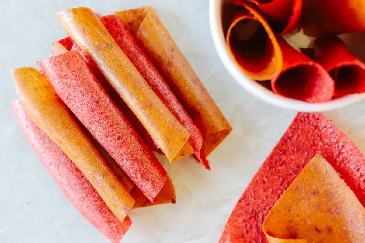 Finished fruit leather strips rolled in parchment paper