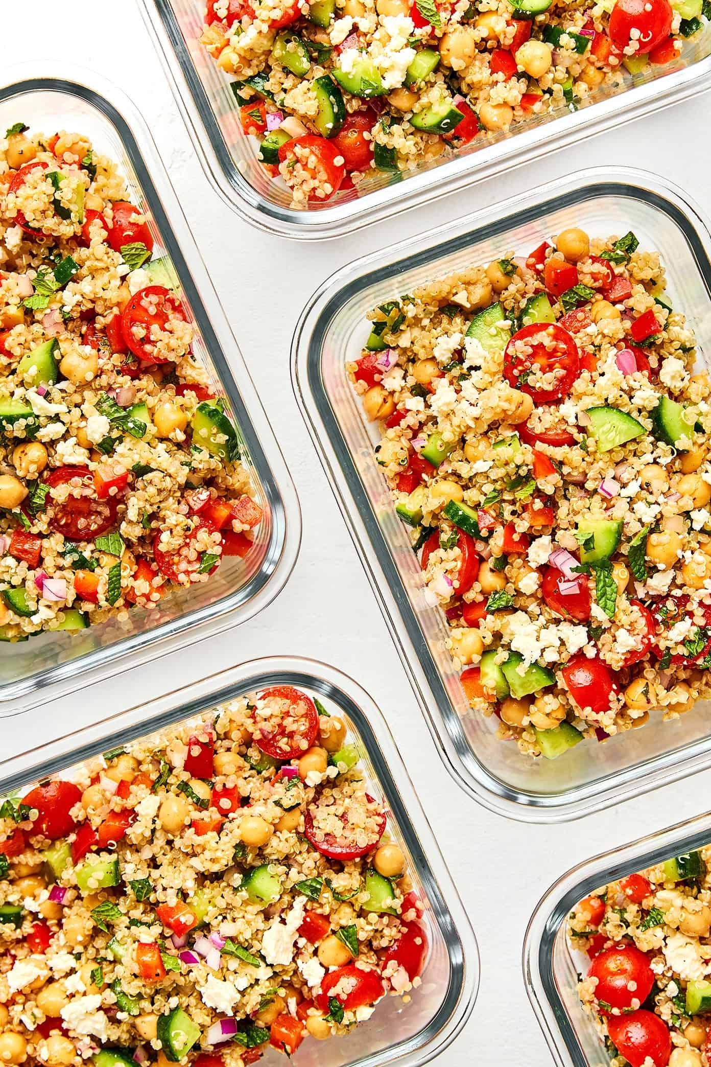 Quinoa salad portions in glass meal prep containers
