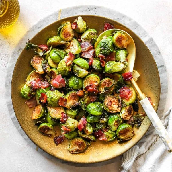 Roasted Brussels sprouts with crumbled bacon in a bowl