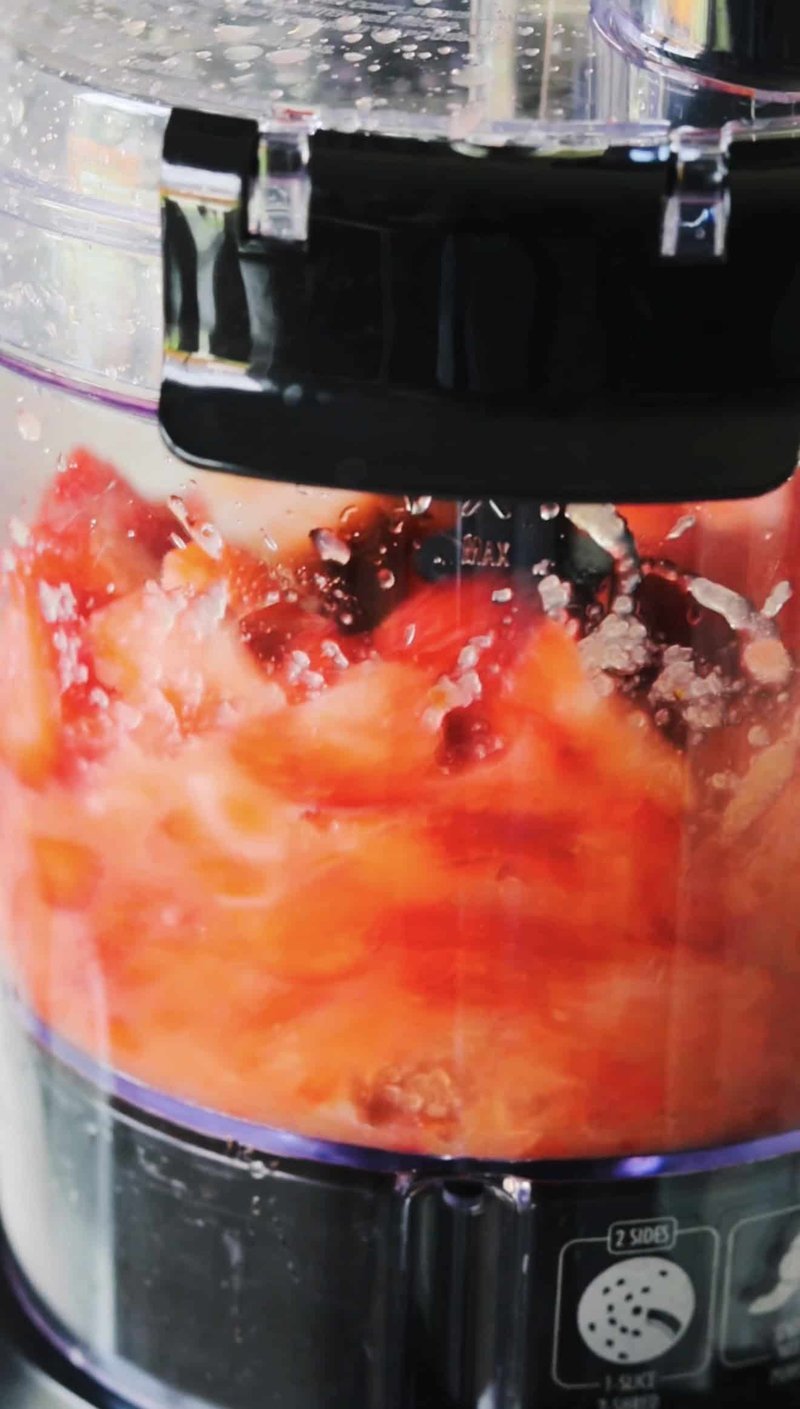 Fruit puree spread on a parchment-lined baking sheet in the oven